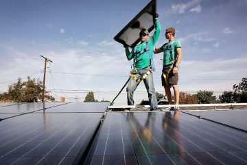 installing solar modules on the roof of a house